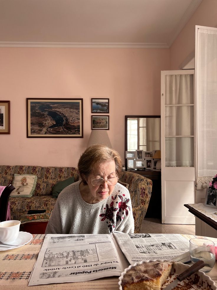 A senior enjoying her morning reading at home with care support